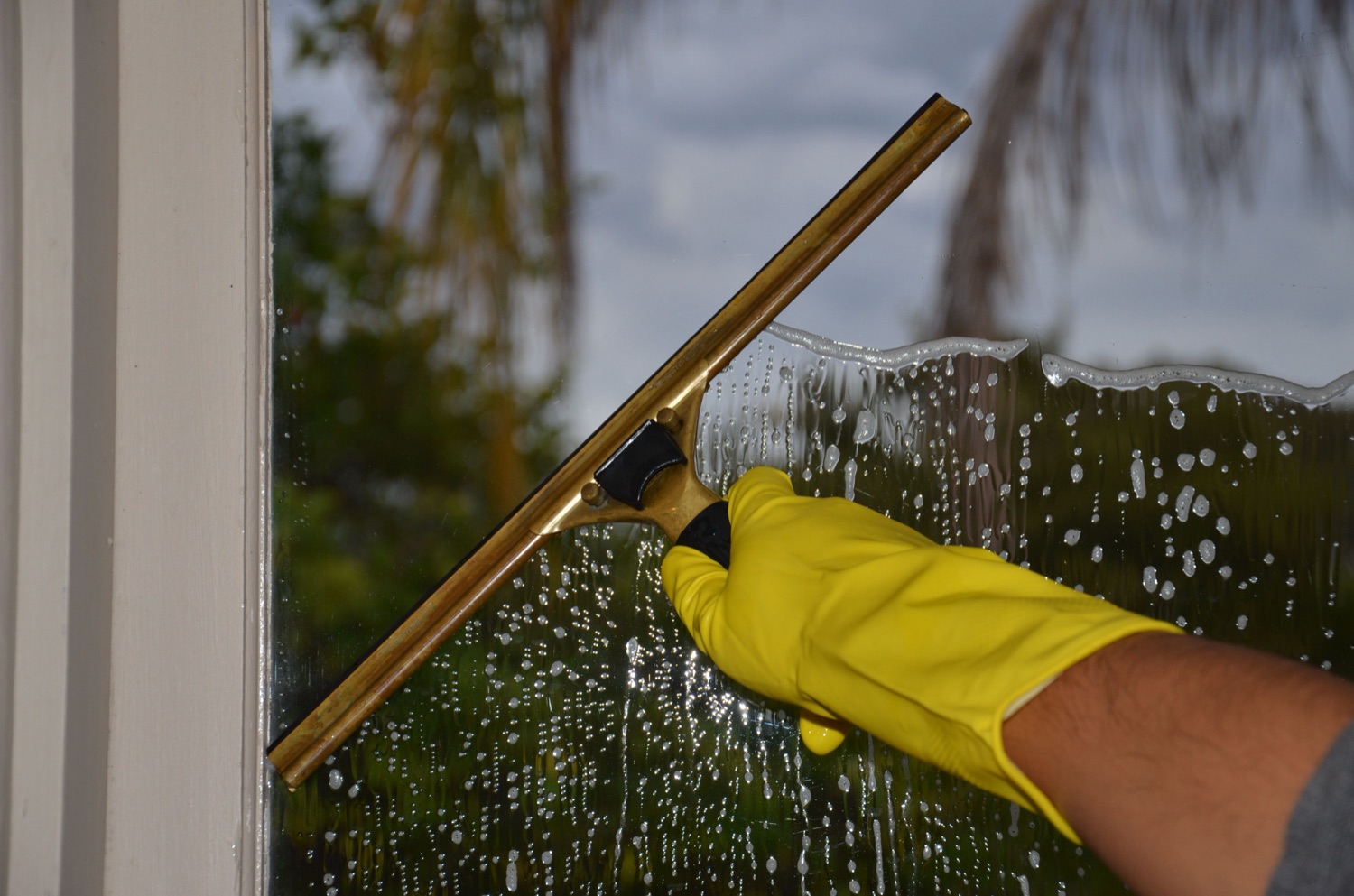 Squeegee cleaning commercial glass